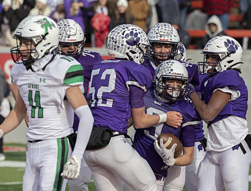 Wilmington's Ryan Kettman is celebrated after scoring a TD against Athens Friday, Nov. 24, 2023 in the 2A state football championship game at Hancock Stadium in Normal.