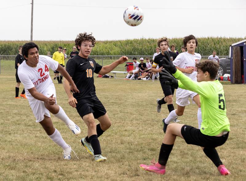 Ottawa's Luis Bedolla (24) gets past Sandwich defender Luigi Colin (10) and sends a shot past Sandwich keeper Blake Blue (5) during the Serena Tournament held Saturday, Aug. 26, 2023.