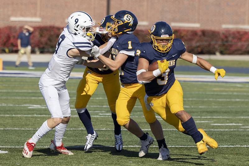 Sterling’s Antonio Tablante hits the hole in the first half of the Warriors’ first round playoff game Saturday, Oct. 29, 2022 against St. Viator.