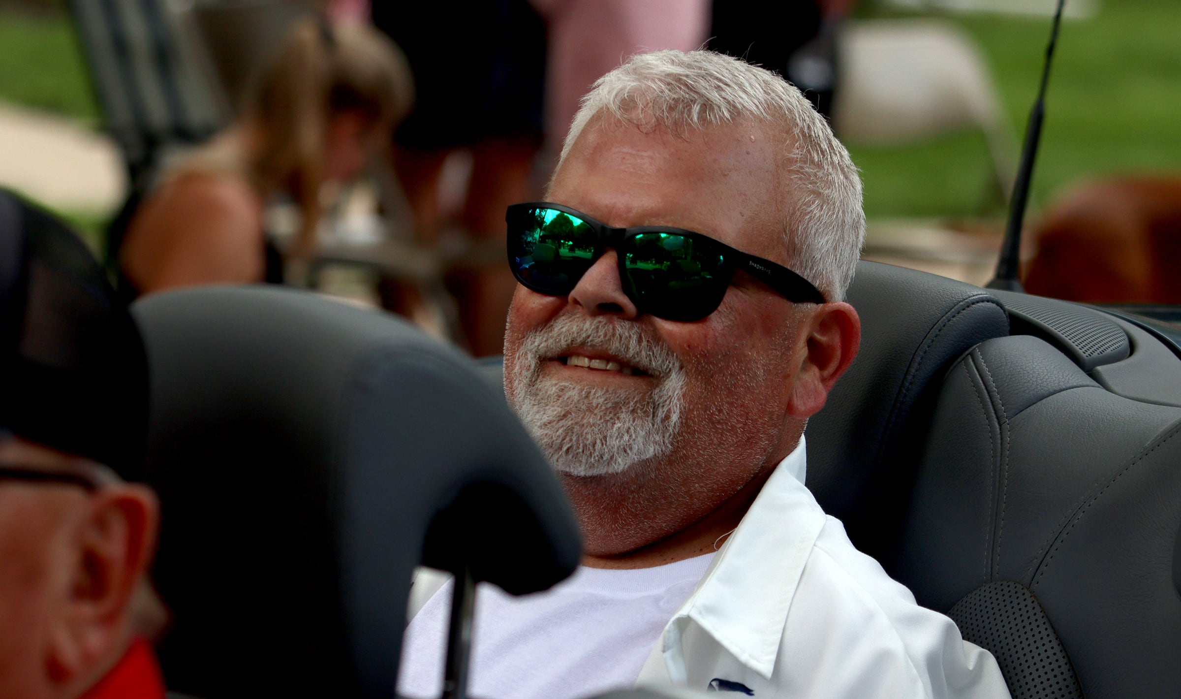 Parade Marshall Todd Lowenheim rides in a convertible as part of the Fiesta Days parade along Main Street in McHenry Sunday.