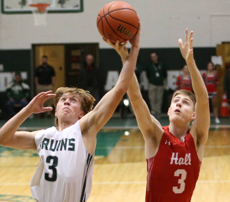 St. Bede's Callan Hueneburg (left) and Hall's Max Bryant (right) grab a rebound at the same time on Monday, Dec. 14, 2022 at St. Bede Academy.