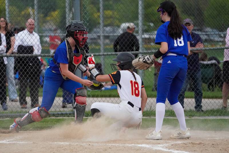 Batavia’s Gwen Shouse slides into home for a score off of a wild pitch by Geneva during a softball game at Batavia High School on Wednesday, May 8, 2024.