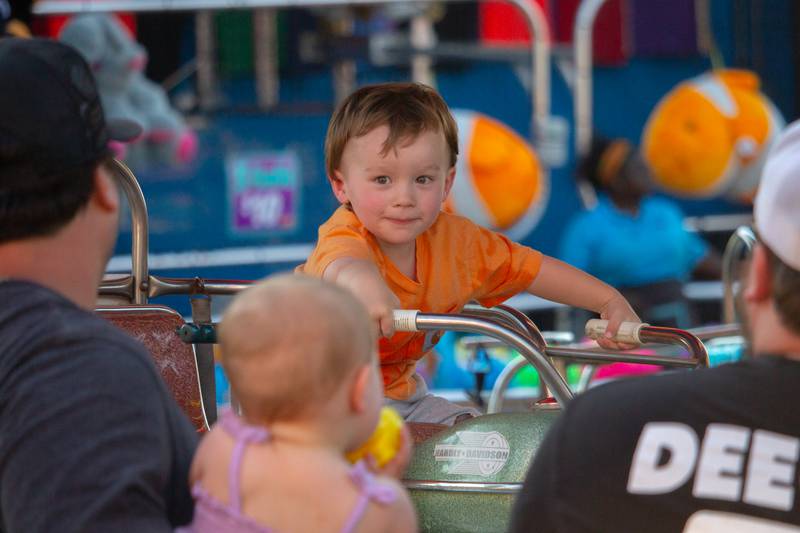 Kid smiles on Motorcycle ride on Friday, June 21, 2024 at the Ottawa Lions Club Carnival in Ottawa.