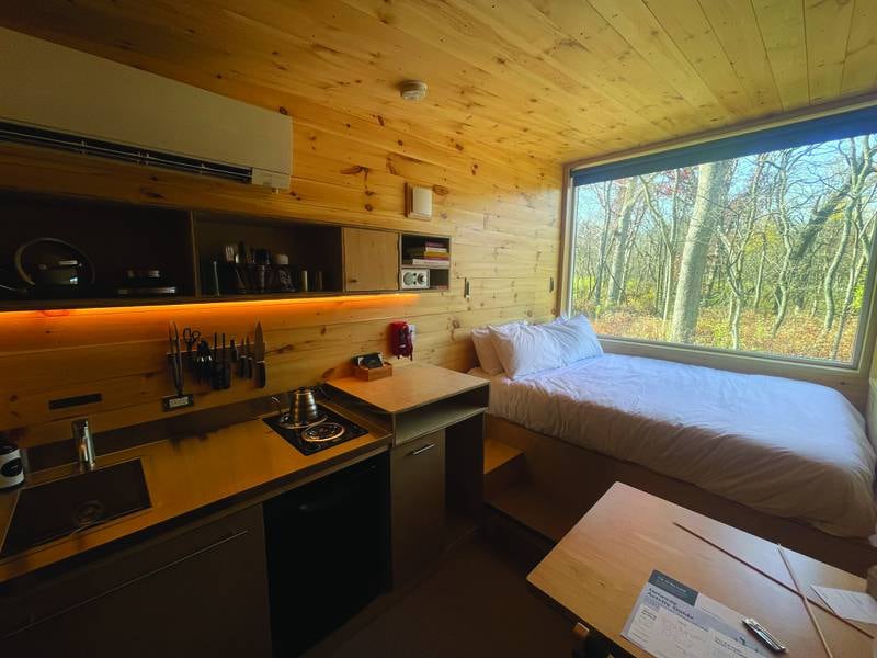 A view of the kitchen and bed inside the tiny cabin at Getaway Starved Rock, located at 1879 N. 2703rd Road in Ottawa.