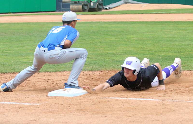 Wilmington's Lucas Rink slides safely back to the bag at first base as Newman's Isaiah Williams makes a catch during the Class 2A third place game on Saturday, June 1, 2024 at Dozer Park in Peoria.