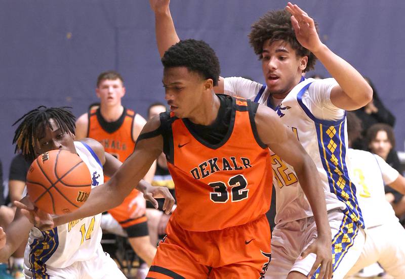 DeKalb’s Justin O’Neal saves a ball from going out of bounds in front of Warren's Alex Daniels Tuesday, Feb. 27, 2024, during their Class 4A sectional semifinal game at Rock Valley College in Rockford.