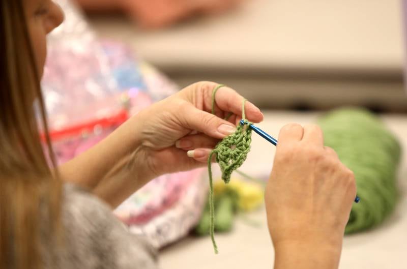 Lucy Gardner of Sandwich works on a crochet project during a session of the Knit and Crochet Group at the Plano Community Library District.
