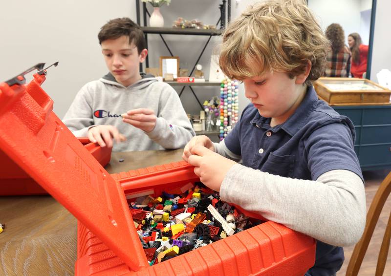 Noah Murcia, (left) 9, and Alex Murcia, 8, work with Legos Friday, March 18, 2022, at 35:35 Makers Collective located at 308 West State Street in Sycamore. The store, scheduled to open April 1, will feature the work of local artisans and offer craft and kids classes. The first class, a Lego Build Day, will be held Friday April 15 and be led by Noah, Alex and their mom Ashley Murcia.