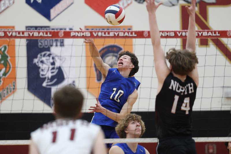 Lincoln-Way East’s Matthew Muehinickel hits a shot against Plainfield North on Tuesday, April 2, 2024.