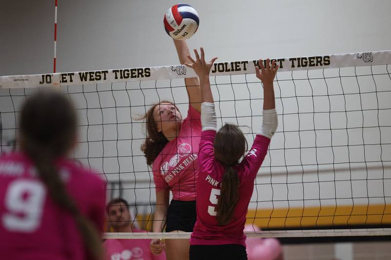 Joliet West’s Natalia Harris goes for the kill against Joliet Central in the JTHS Pink Heals match. Tuesday, Oct. 4, 2022, in Joliet.