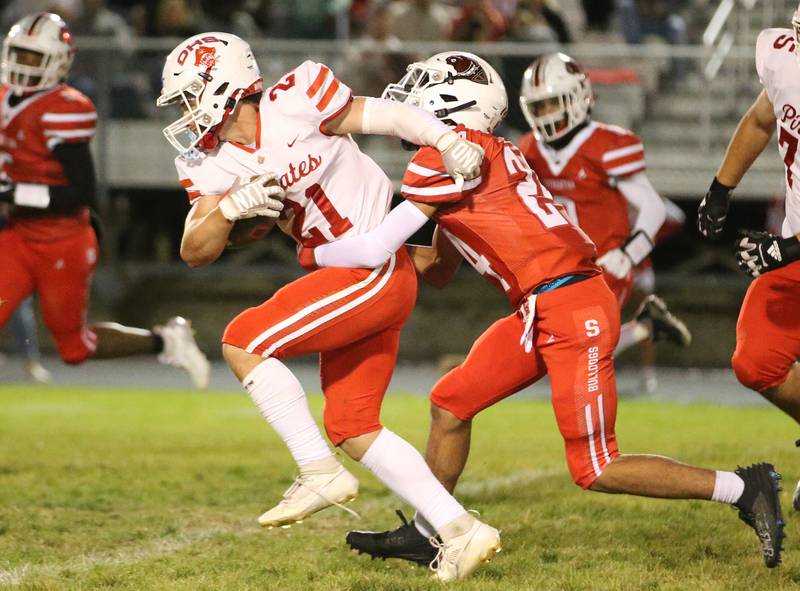 Ottawa's Jace Vieth runs the ball as Streator's Jai Andre Williams wraps up on Friday, Sept. 6, 2024 at Doug Dieken Stadium.