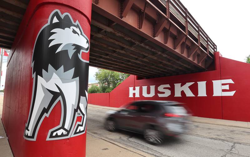 A vehicle drives by the new Huskie mural Monday, Aug. 7, 2023, on the Annie Glidden Road railroad underpass, just south of Lincoln Highway in DeKalb. The mural was a joint project between the City of Dekalb and Northern Illinois University.