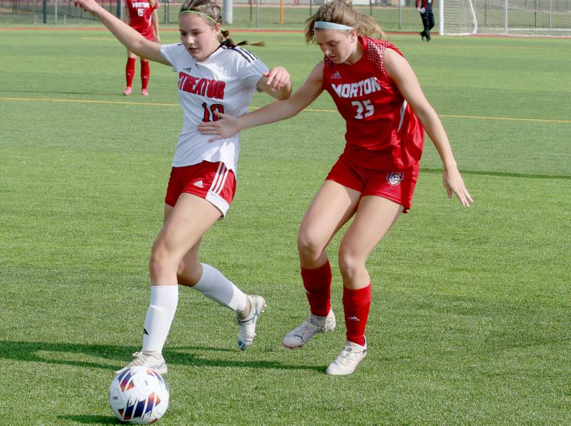 Streator's Kaelin Schuster kicks the ball away from Morton's Lillian Klopfenstein during the Class 2A Regional semifinal game on Wednesday, May 15, 2024 at the L-P Athletic Complex in La Salle.