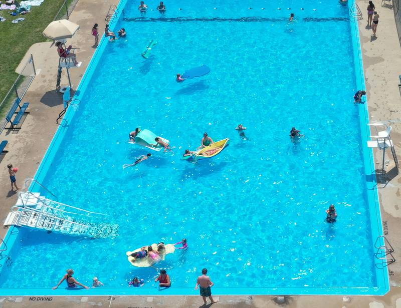 Dozens of people cool off in Alexander Pool on Wednesday, July 26, 2023 in Princeton.