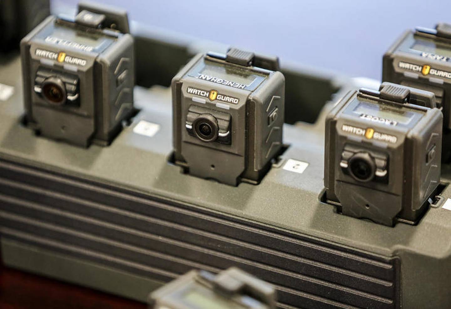 Several Watch Guard body cameras sit in a charging station on Thursday, Aug. 1, 2019, at the Rockdale Police Department in Rockdale, Ill.