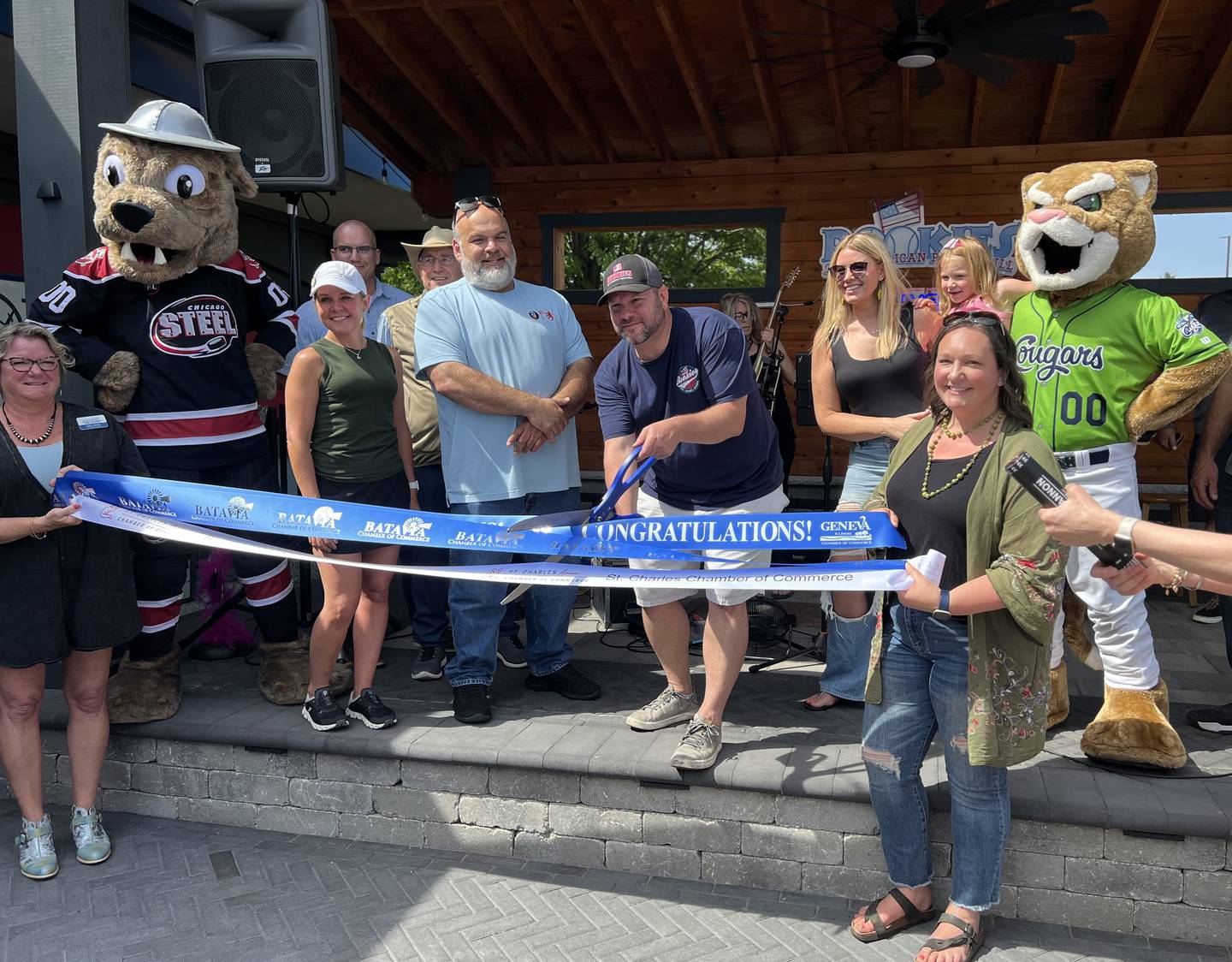 Representatives of the three local Chambers of Commerce presided over the celebration of Rookies All-American Pub & Grill with a ribbon cutting ceremony on Friday, May 31 along with Bob Karas, owner of Rookies, and Rookies Geneva Manager Grant Werner. Among those in attendance were St. Charles Mayor Lora Vitek, Patti Anselme, Batavia Chamber special events coordinator; Shirley Mott, chamber communications and membership coordinator; and Jamie Saam, president of the Batavia Chamber board of directors.