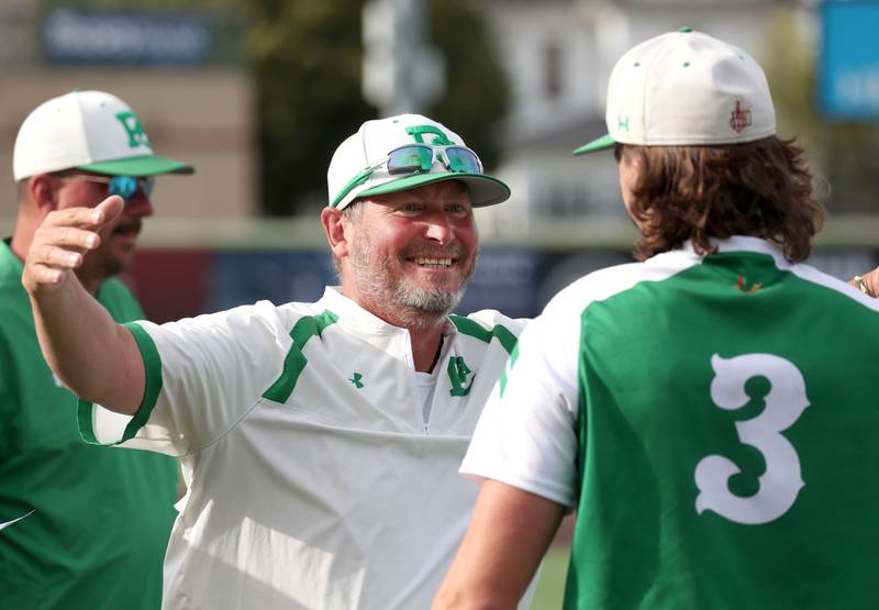 Providence Catholic head coach Mark Smith hugs starting pitcher Cooper Eggert after their Class 4A state semifinal win over Edwardsville Friday, June 7, 2024, at Duly Health and Care Field in Joliet.