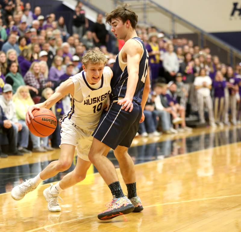 Serena’s Carson Baker (left) tries to get around Harvest Christian Academy’s JJ Gonnam during the Class 1A Harvest Christian Academy Sectional semifinal game against on Wednesday, Feb. 28, 2024 in Elgin.