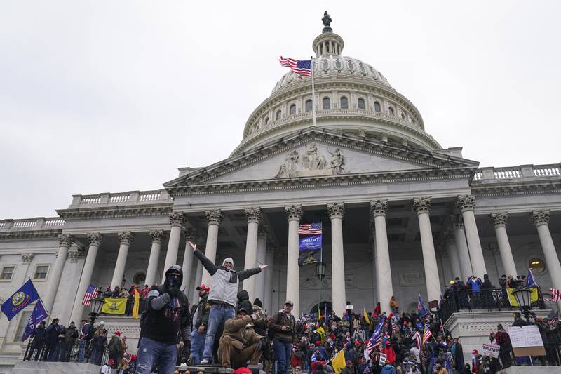 Rioters at the U.S. Capitol on Jan. 6, 2021, in Washington. Hundreds of people charged with storming the U.S. Capitol three years ago have had a powerful incentive to plead guilty rather than go to trial. An Associated Press review of over 1,200 cases arising from the Jan. 6, 2021, attack found that the average prison sentence for a Capitol riot defendant convicted of a felony after a trial is roughly four years and three months. (AP Photo/John Minchillo)