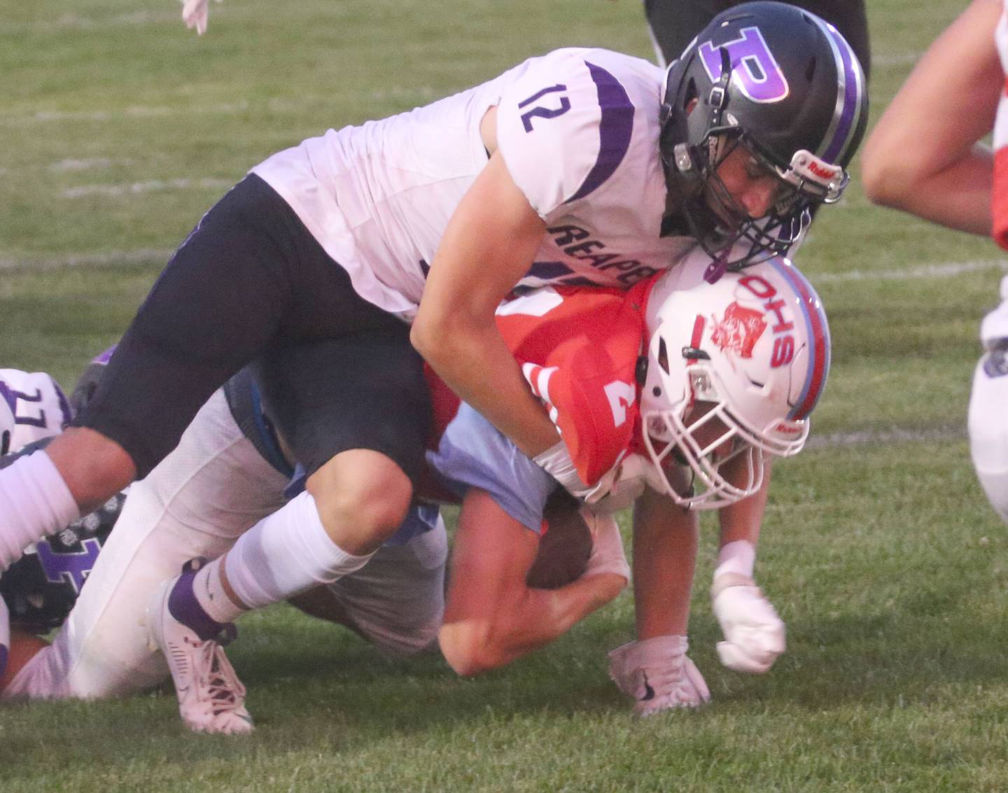 Ottawa's Weston Averkamp scores a touchdown as he is brought down in the end zone by Plano's Dylan Saunders on Friday, Aug. 30, 2024 at King Field.