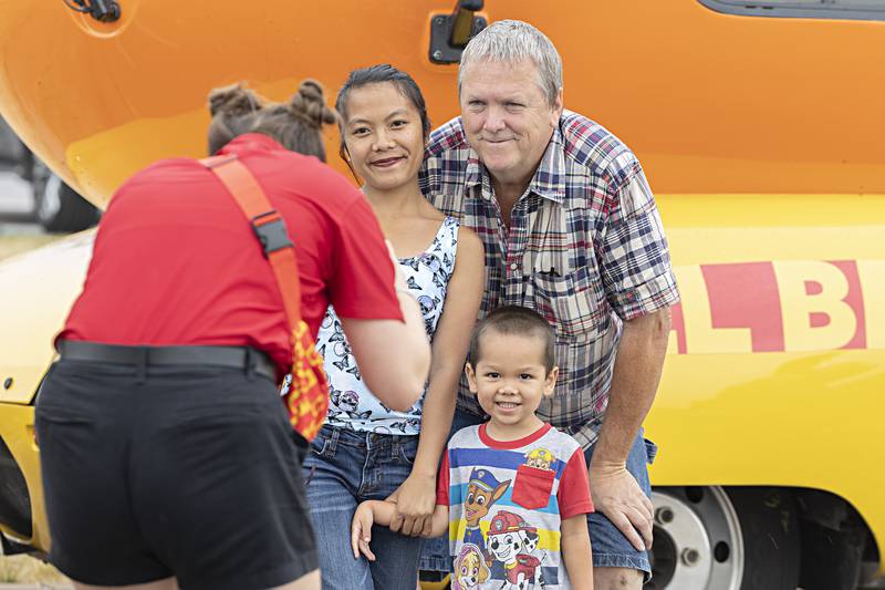 Kevin, Emma and Emerson Kaecker, 3, of Rock Falls has a family photo taken Friday, June 30, 2023 in front of the Oscar Mayer Frankmobile. The traveling hot dog recently had a name change from the Weinermobile.