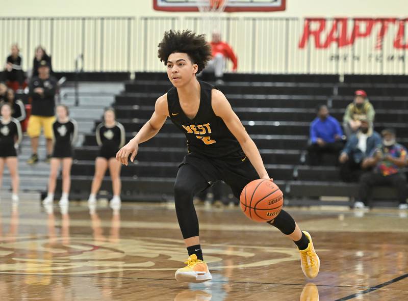 Joliet West's Corey Nobles dribbles the ball up court during the Class 4A sectional semifinal against Homewood Flossmoor at Rich Township on Tuesday, Feb. 27, 2024, at Richton Park. (Dean Reid for Shaw Local News Network)