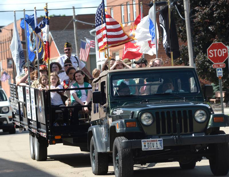 The Oregon VFW Jeep pulls a wagon with veterans and Scouts to Riverside Cemetery in Oregon for the Memorial Day service on Monday, May 27, 2024.