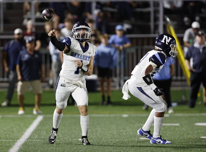 Nazareth's Logan Malachuk (1) throws against Mt. Carmel during the varsity football game between Nazareth Academy and Mt. Carmel high school on Friday, Sep. 13, 2024 in Chicago.