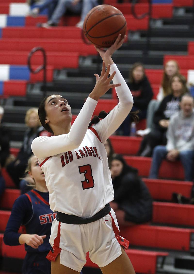 Huntley’s Cassidy Serpe shoots the ball in front of South Elgin’s Addison Tinerella follow on Tuesday, Nov. 21, 2023, during a basketball game in the Dundee-Crown High School Girls Thanksgiving Tournament in Carpentersville.