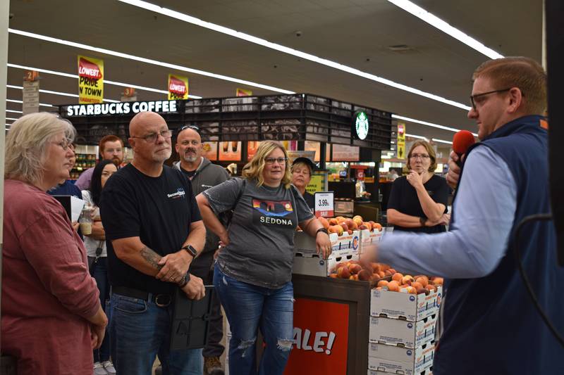 Hometown Hero finalists Jeff and Dana VanAutreve listen to instructions after being selected for the grand prize, a two-minute Peru HyVee shopping spree.