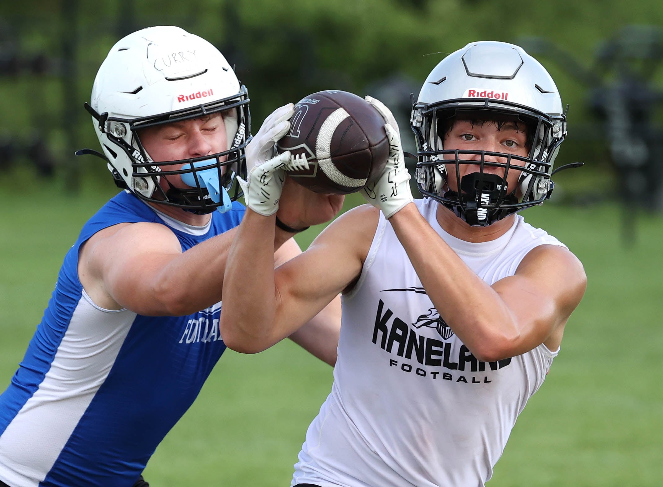 Kaneland’s Dylan Sanagustin catches a pass in front of a Geneva defender Tuesday, July 16, 2024, during their matchup in the Kaneland 7-on-7 at the school in Maple Park.