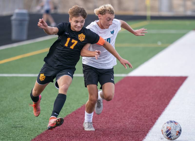 Richmond-Burton's Joe Kyes, left, and Woodstock North's Barek Blue battle for control of the ball during their varsity soccer game on Wednesday, September 18, 2024 at Richmond-Burton High School in Richmond.