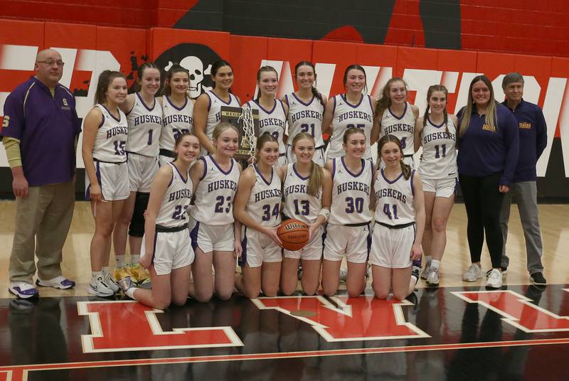 Members of the Serena girls basketball team pose with the Class 1A Regional plaque after defeating Ashton-Franklin Center on Thursday, Feb. 15, 2024 at Earlville High School.