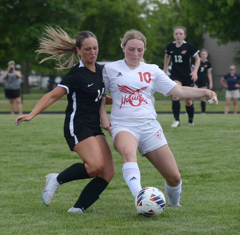 Oregon's Shaylee Davis (10) and Stillman Valley's Amelia Dunset fight for the ball during the 1A Indian Creek Sectional on Saturday, May 18, 2024.