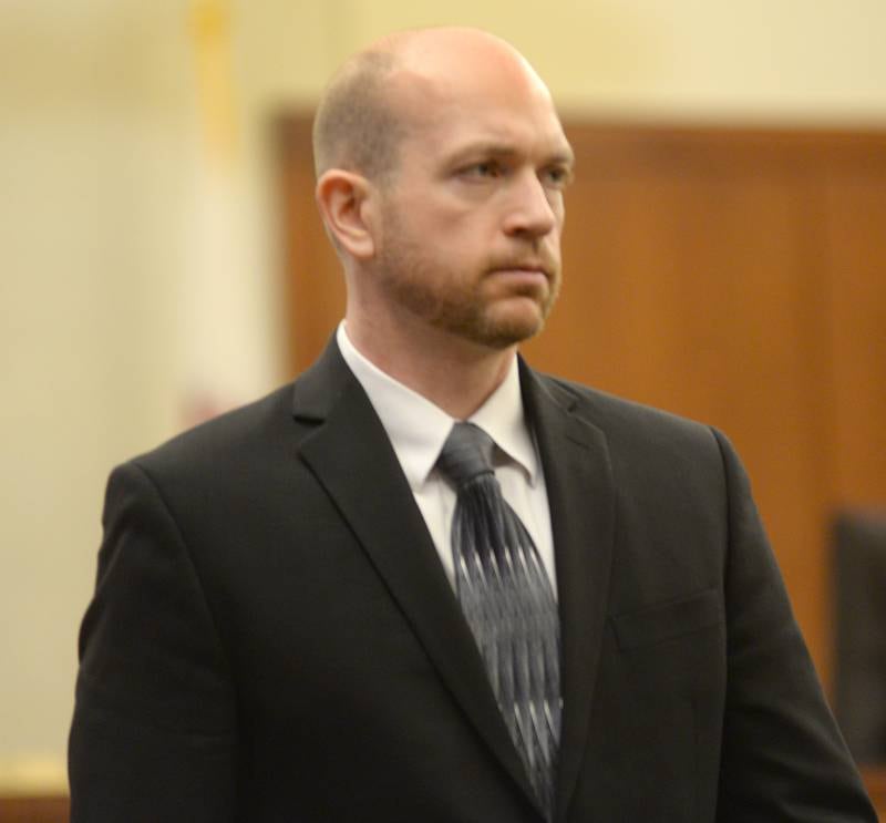 Matthew Plote walks to the defense table during the first day of his trial at the Ogle County Judicial Center in Oregon on Monday, March 18, 2024.