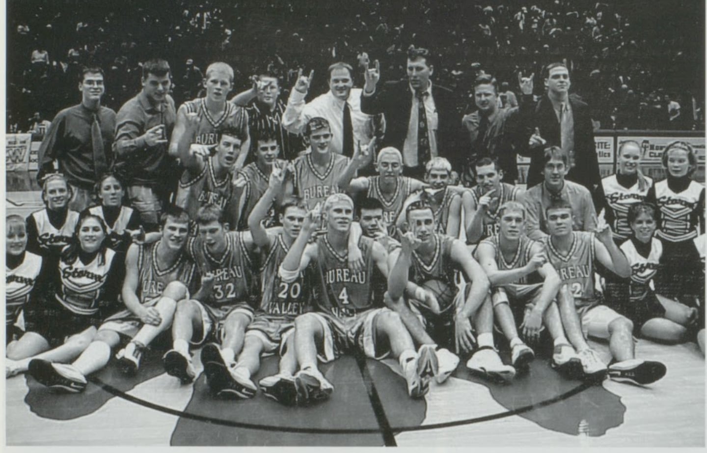 The 2000-01 Bureau Valley Storm basketball team celebrates the second of three straight third-place finishes from the IHSA State Basketball Tournament.