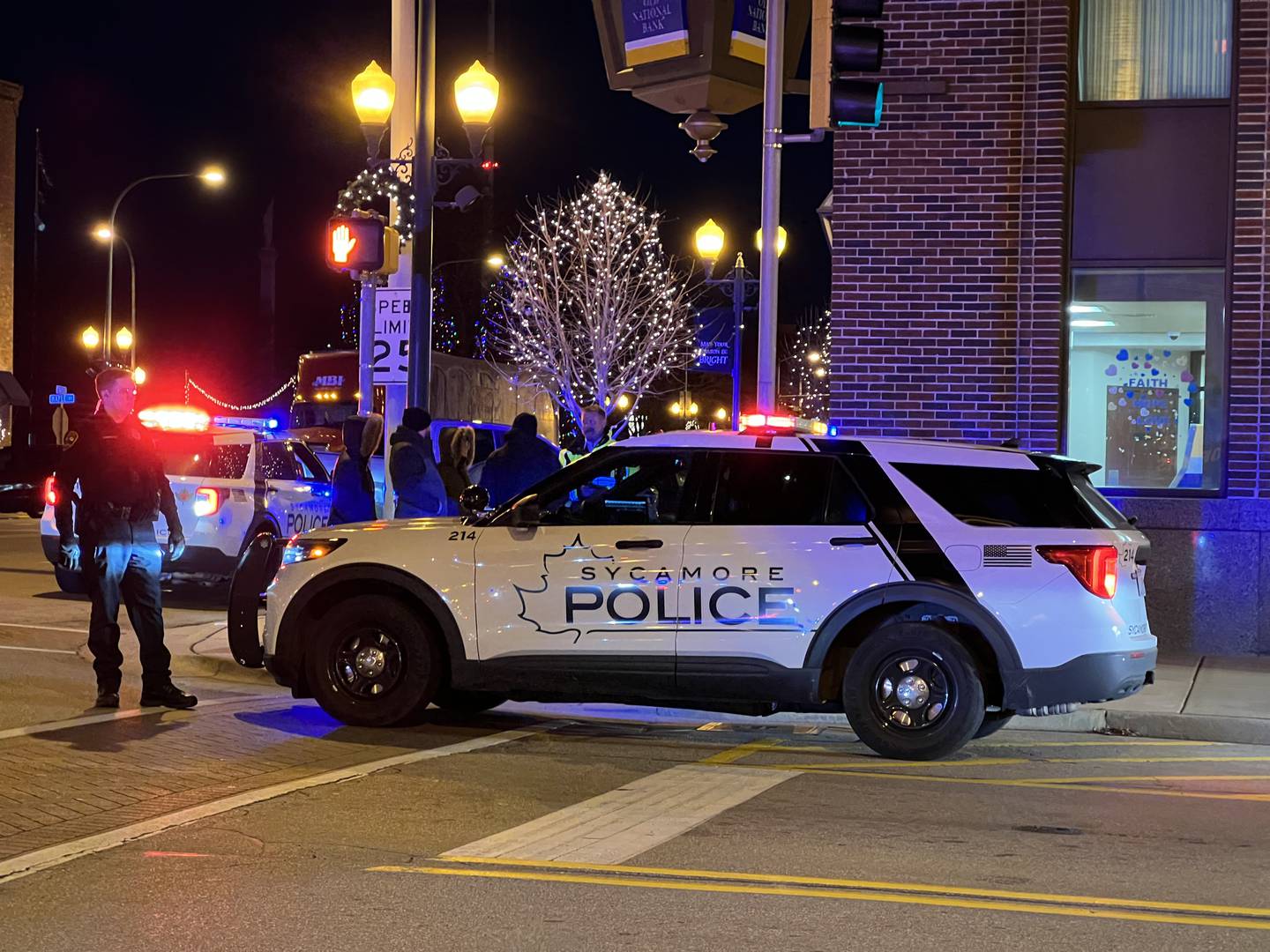 Sycamore police helped close intersections in downtown Sycamore on Monday, Dec. 18, 2023, for a motorcade honoring city firefighter Brad Belanger on his way home from Northwestern Medicine Central DuPage Hospital in Winfield.