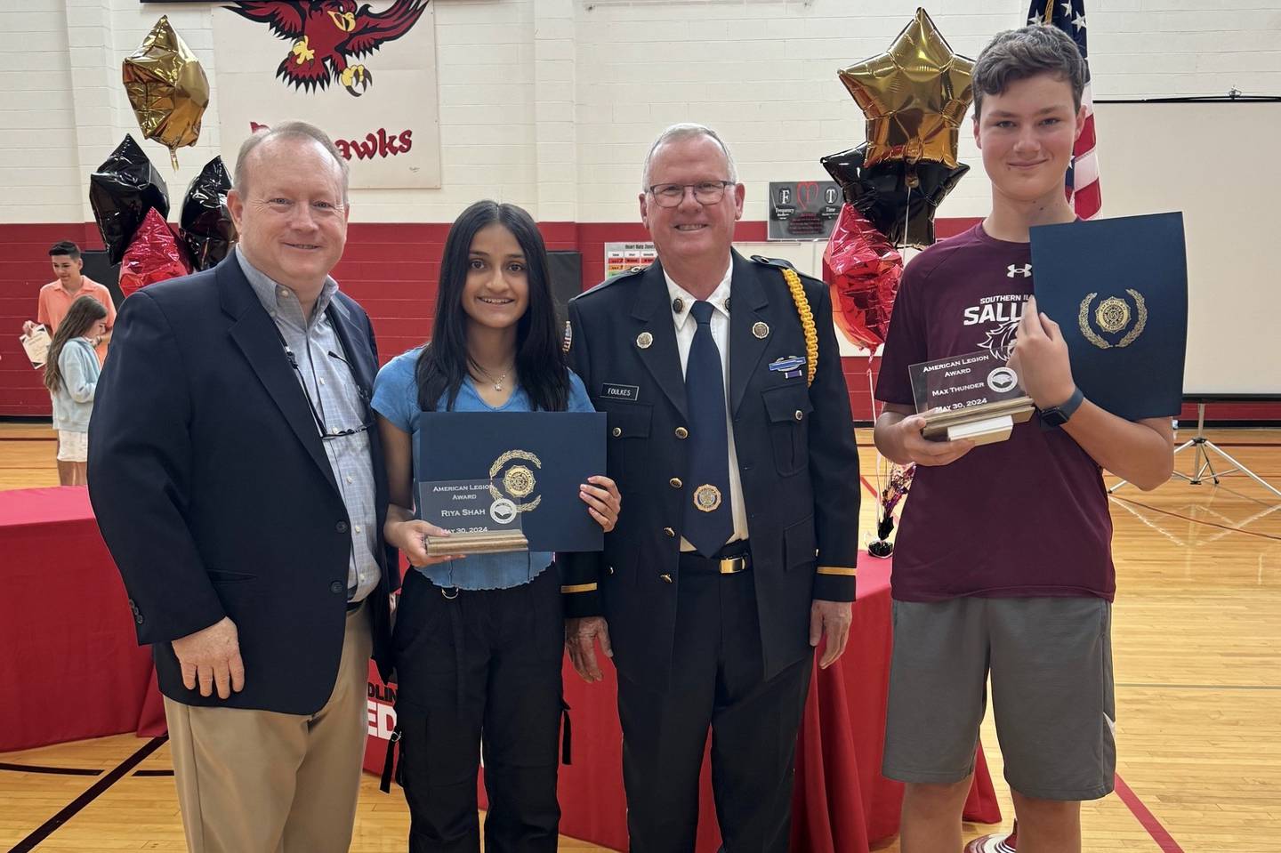 St. Charles American Legion Post 342 member Mike Foulkes presents Wredling Middle School students Riya Shah and Maximillian Thunder with the American Legion School Award at the 8th grade awards ceremony on May 30, 2024.
(From Left: Wredling Middle School Principal Tim Loversky, Shah, Foulkes and Thunder)