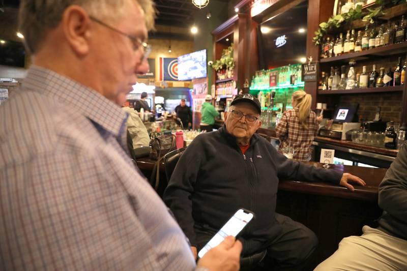 Kane County Board District 12 Republican incumbent Bill Roth (left) and District 16 incumbent Mike Kenyon await  election results at Old Towne Pub and Eatery in Campton Hills on Tuesday, March 19, 2024.