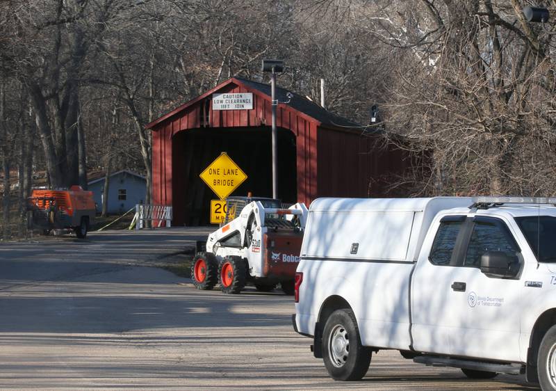 An Illinois Department of Transportation crew begins repairs on the Red Covered Bridge on Monday, Dec. 11, 2023 in Princeton. The bridge was severely damaged when it was struck by a semi truck on Nov. 16.