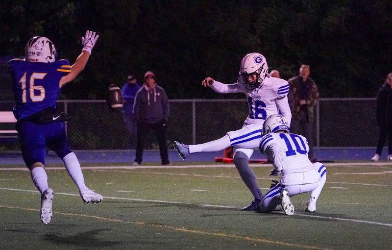 Geneva’s Jayden Hodgdon (16) kicks an extra point against Wheaton North during a football game at Wheaton North High School on Friday, Oct. 6, 2023.