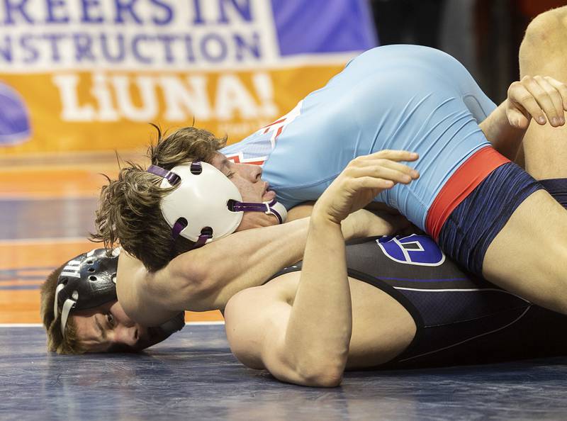 Marian Central’s Jimmy Mastny pins Oakwood’s Bryson Capansky in the 1A 126 pound championship match Saturday, Feb. 17, 2024 at the IHSA state wrestling finals at the State Farm Center in Champaign.