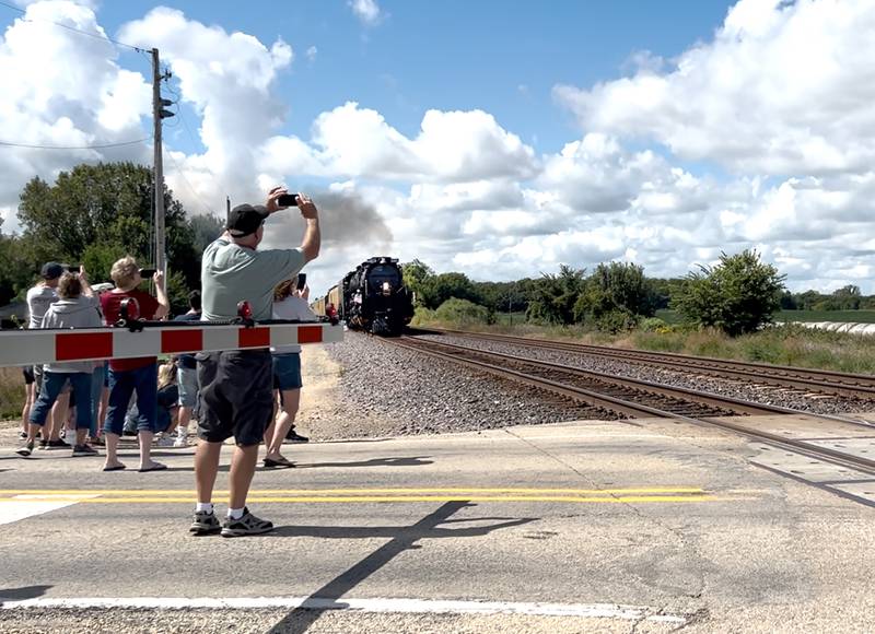 Thirty people watched the Union Pacific's Big Boy steam engine power its way across the Frog Pond crossing, east of Fulton, on Friday, Sept. 6, 2024. The vintage engine was headed to Sterling for a whistle stop before heading to Rochelle where it can be viewed by the public on Sunday, Sept. 8, 2024.