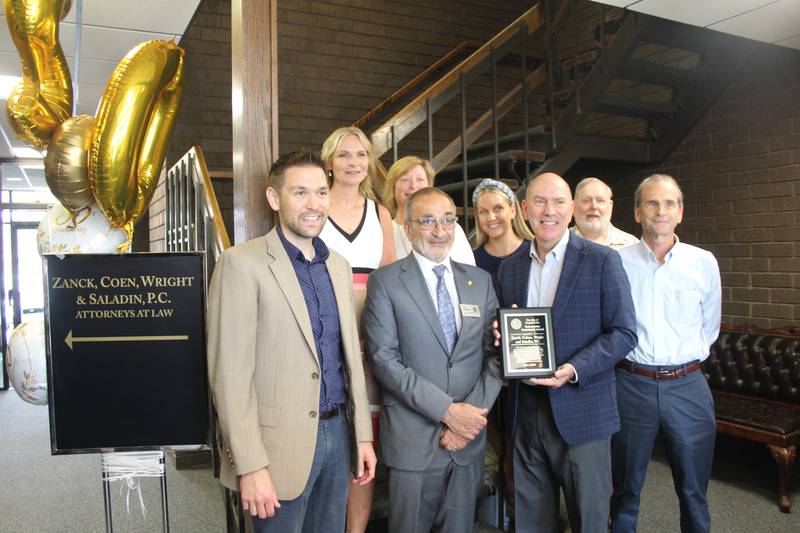 Zanck, Coen, Wright & Saladin, P.C. attorneys and Crystal Lake Mayor Haig Haleblian (center left) celebrate the law firm's 50 year anniversary Thursday.