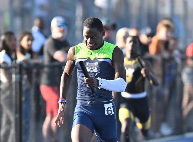 Oswego East's Nigel Grisby competing in the 4x200 meter relay during the IHSA 3A Sectional track meet  on Friday, May. 17, 2024, at Joliet.