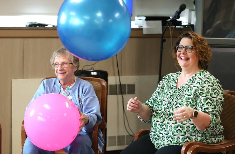 Barb City Manor resident Vivian Slade (left) and Barb City Manor Associate Director Ann Cheladyn enjoy an activity Tuesday, July 2, 2024, at the retirement home in DeKalb. The facility celebrated its 45th anniversary earlier this year.