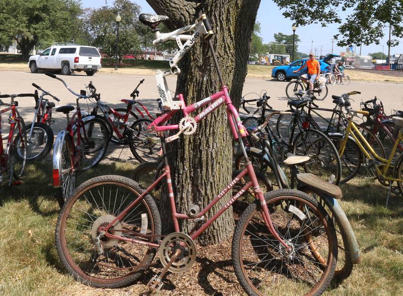 A creative two story bicycle leans against a tree during the inaugural Bike Fest on Saturday, June 24, 2023 at Rotary Park in Princeton.