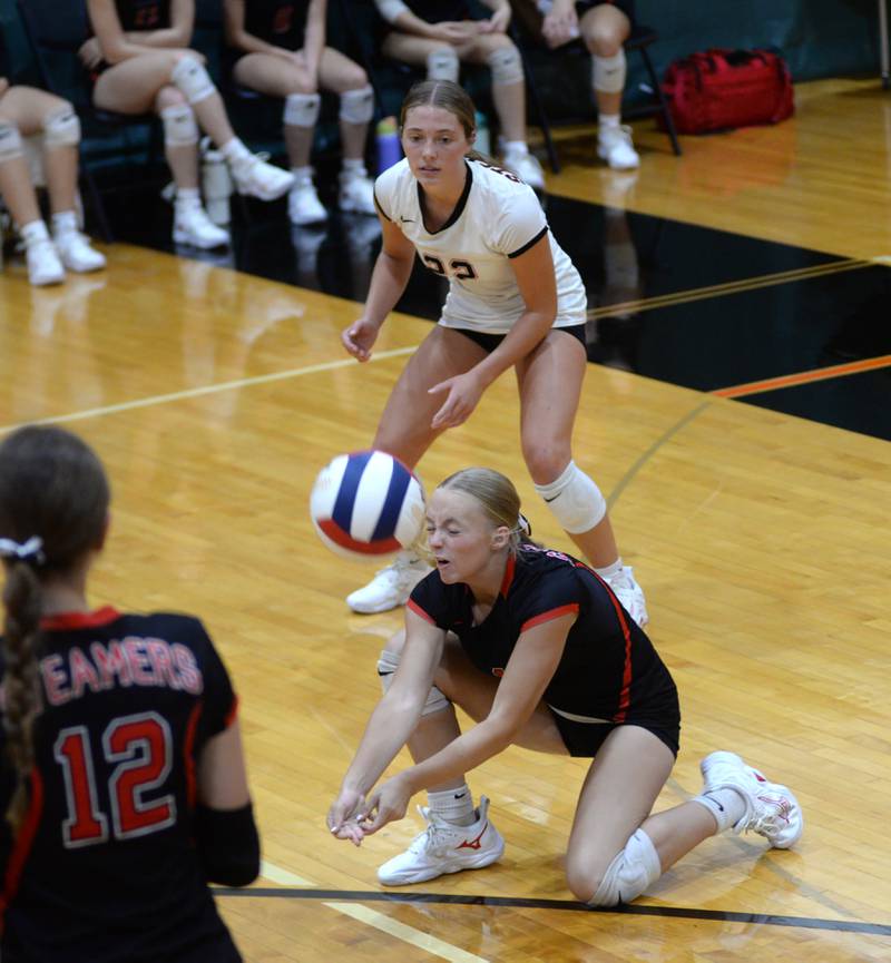 Fulton's Belle Curley (1) digs a hit as Resse Germann (22) watches during a match with Rochelle on Saturday, Sept. 14, 2024 at the Varsity Power Classic Tournament at Byron High School.