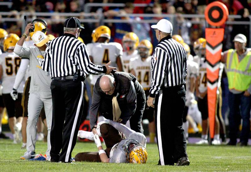 Jacobs’ Caden DuMelle is tended to on an injury time out in varsity football on Friday, Sept. 6, 2024, at Hampshire School in Hampshire.