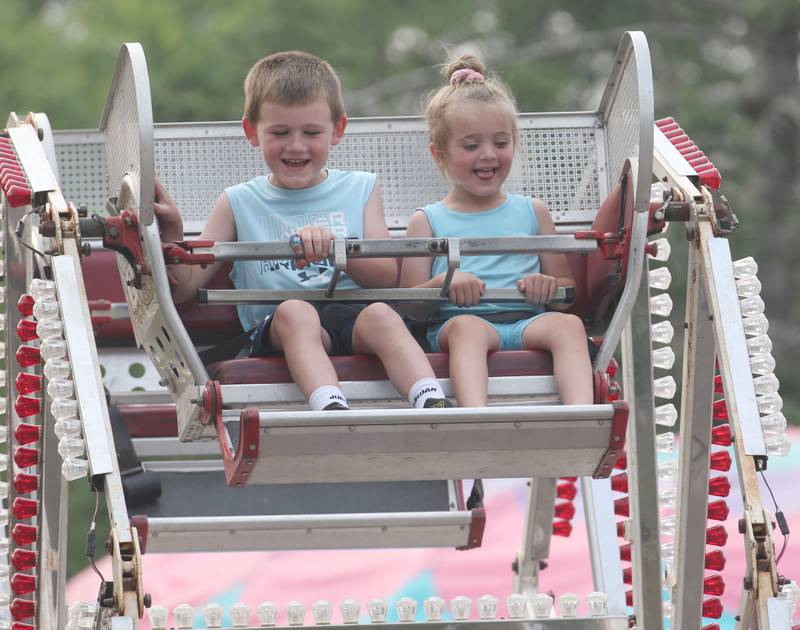 Axel Swords and his sister Millie ride the Ferris Wheel ride at the Lions Club Carnival on Thursday, June 15, 2023 in Ottawa.